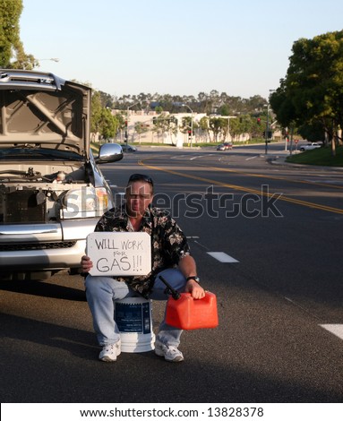 a man out of gas holds an empty gas can and a \