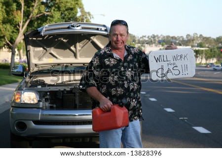 a man out of gas holds an empty gas can and a \