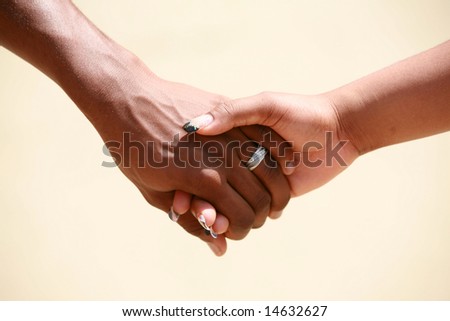 a couple holds hands