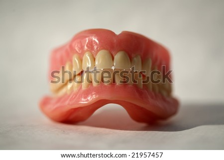 Genuine Dentures AKA False Teeth from a Dentist Office on white