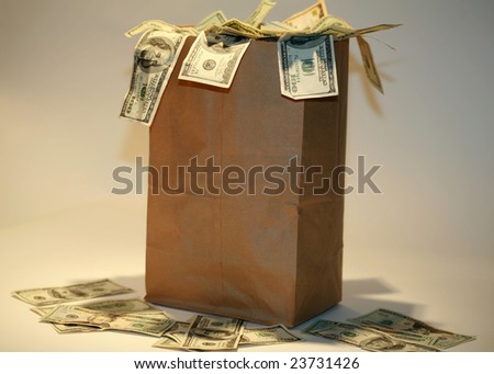 a Generic brown paper bag over flowing with Money