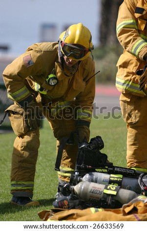 LAGUNA BEACH, CA - FEB 19: Firefighter recruits take a break during fire fighting drills at the local Fire Department training area on February 19, 2009 in Laguna Beach, California.