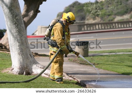 LAGUNA BEACH, CA - FEB 19: Firefighter recruits practice fire fighting drills at the local Fire Department training area on February 19, 2009 in Laguna Beach, California.