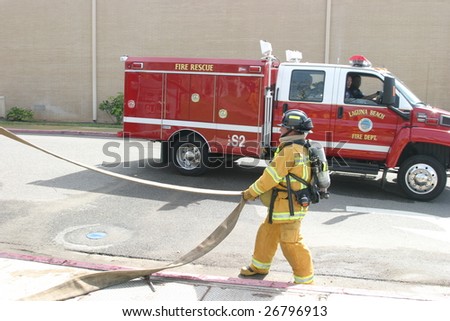 LAGUNA BEACH, CA - FEB 19: Firefighter recruit ready for action during fire fighting drills at the local Fire Department training area on February 19, 2009 in Laguna Beach, California.