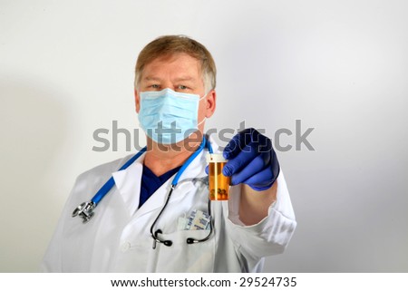 A Doctor in a Paper Mask holds a bottle of pills representing the Mexican Swine Flu Pandemic