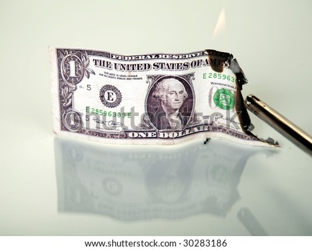 a one dollar bill on fire  \