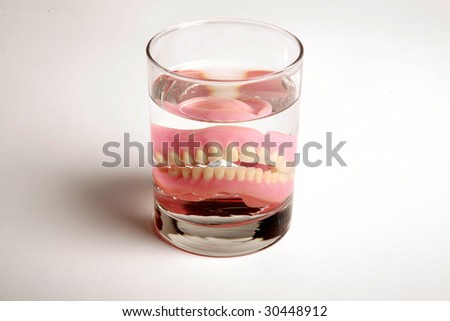 False Teeth in a glass of water