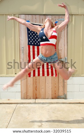a happy woman jumps for joy because she is free and in america on the forth of july