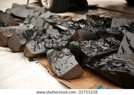 Tar ready to be melted for a roof repair job