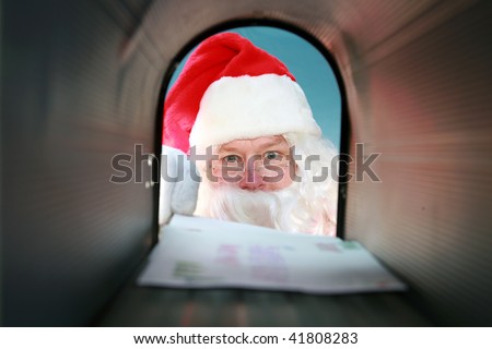 Santa Claus gets his mail from his mail box, as seen from the inside out