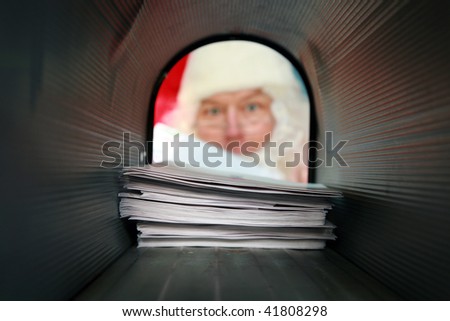 Santa Claus gets his mail from his mail box, as seen from the inside out