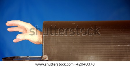 a hand reaches out from inside a mail box