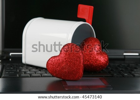 a laptop computer with a mail box isolated on white with  Valentines Day Hearts represents \