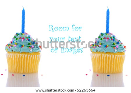 angelfood cupcake with blue frosting, sprinkles and a candle. isolated on white with room for your text or images