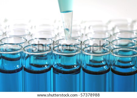 Science and Medical Research Test Tubes, being filled with pipette\'s and other filling devices