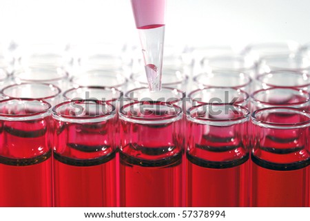 Science and Medical Research Test Tubes, being filled with pipette\'s and other filling devices