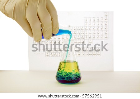 a chemist or medical research scientist adds chemicals to a erlenmeyer flask  for a violent chemical reaction