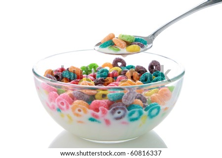childrens breakfast cereal loops with milk. isolated on white