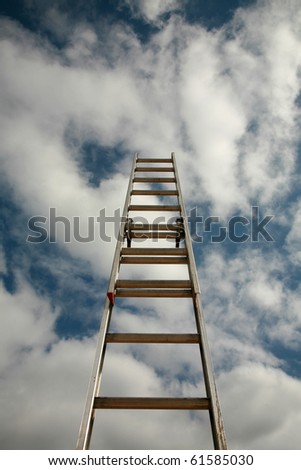 ladder to success, extention ladder extened into the blue sky with great white fluffy clouds. representing success in business, reaching for the stars or clouds, ladder of success, corporate ladder