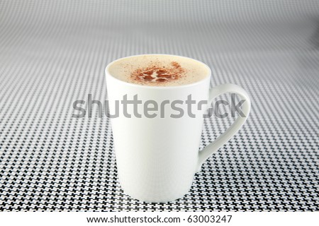 coffee or espresso or cappuccino in a white coffee mug on a black and white background