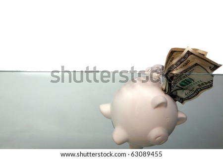 a piggy bank floats in dark murkey water, representing the idea of drowning in debt, or keeping your head above water and other financial concepts