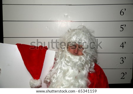 Bad Santa Santa Claus has been a bad bad boy this year and was arrested, and had his mugshot taken Dark Christmas Humor images for all to enjoy