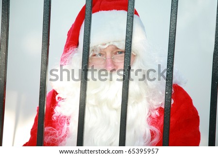 santa claus is behind bars in jail and needs your help to either be bailed out or escape before december 24th or there will no No Christmas for anyone this year