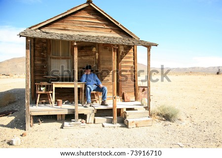 an old cowboy sits on the porch of his home after a hard day of gamblin' n drinkin' n chasin' saloon girls round the piano