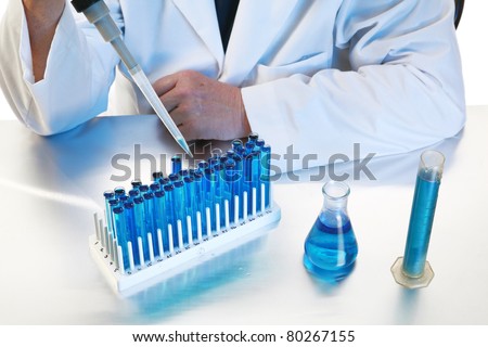 forensic analysis, science, medical, chemistry - a chemist works in his laboratory with various chemicals to document various reactions and interactions. Isolated on white with room for your text.