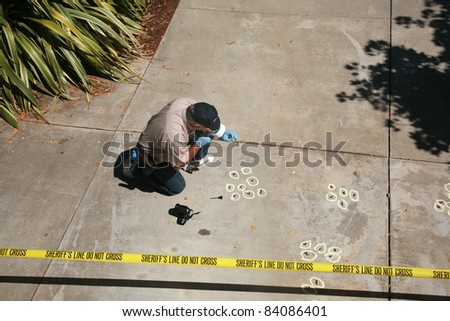 CSI Crime Scene with Chalk Outlines and Sheriff do not cross caution tape. shot outside in direct daylight with shadows.
