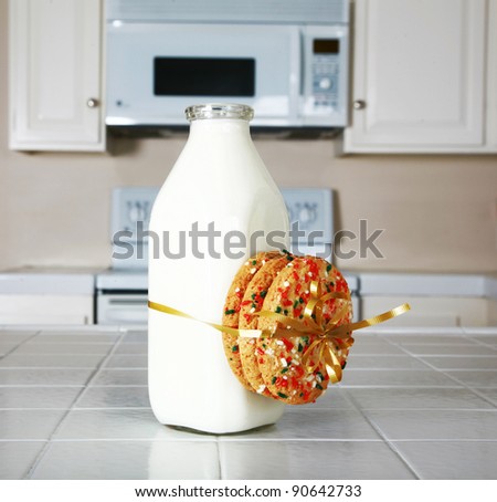 Cookies and Milk with an antique glass milk bottle on a kitchen counter for a after school snack of 