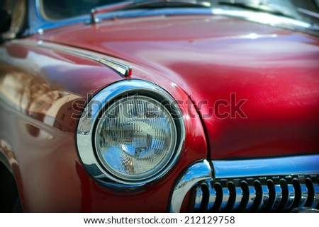 View of red classic vintage Soviet car Gaz