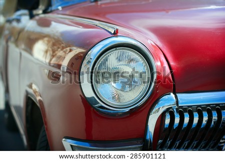 View of red classic vintage Soviet car Gaz Volga