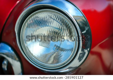 View of red classic vintage Soviet car Gaz Volga