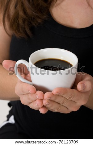 A cup of coffee in hand girl