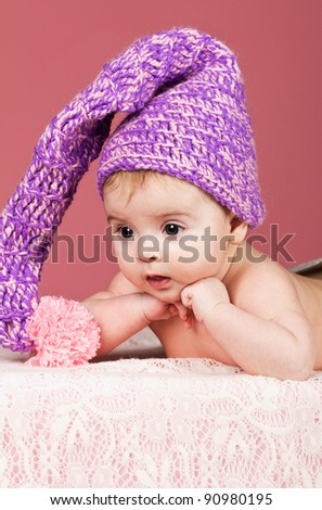 beautiful baby in knitted cap like a leprechaun