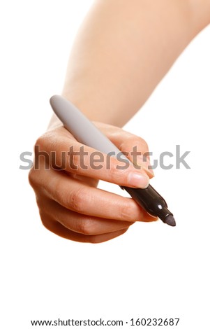 Woman\'s hand with a black marker writing on a white background