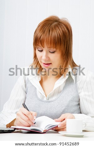 attractive girl with a notebook. Office worker