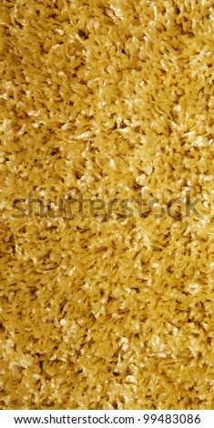 yellow carpet of artificial material close-up. The texture of the carpet