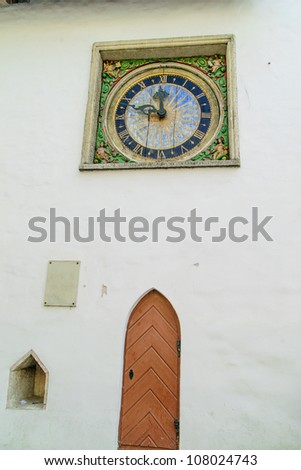 Doorway with clock in the historic port of Tallinn, Estonia, a UNESCO World Heritage Site, situated on the southern coast of the Gulf of Finland