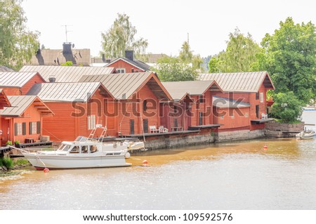 riverside storage houses and museums in picturesque medieval old town of Porvoo, second oldest town in Finland, with many red-colored wooden houses