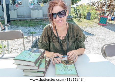 EDEN MILLS, ON - SEPTEMBER 16: Prize winning Canadian writer, Tanis Rideout, signs copies of her recent book at the annual Writers Festival in Eden Mills, Ontario on September 16, 2012.