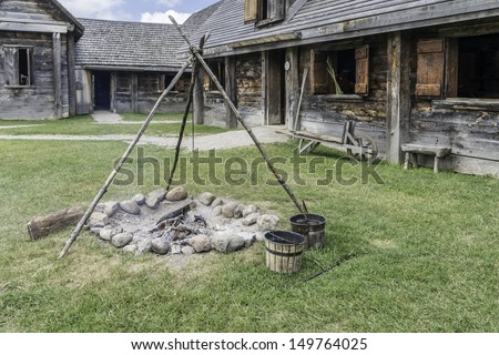 cooking fire in restored 17th century french pioneer settlement in Huron Indian village