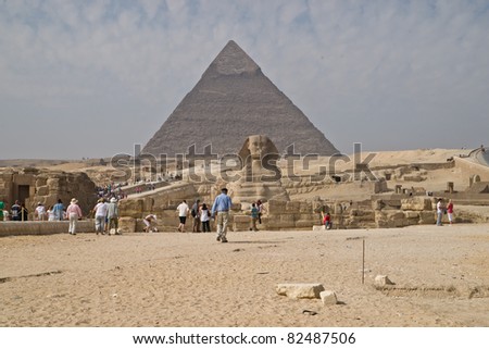 GIZA, EGYPT - NOV 15:  Both tourists and locals visit the Pyramids and Sphinx on November 15, 2010, at Giza, Egypt. The world's oldest tourist attraction, the Pyramids of Giza are 5000 years old.