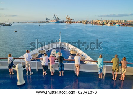 SUEZ CANAL, EGYPT - NOV 17: Unidentified passengers view the Suez Canal at Port Said on November 17, 2010, near Suez. The canal was opened in 1869 to enable shipping directly between Europe and Asia.