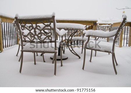 Snow on patio furniture