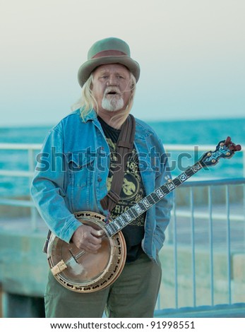 KEY WEST, FLORIDA - DEC 1: Street performer in Key West on December 1, 2011. Before sunset each evening, buskers & entertainers at Mallory Square Dock in Key West perform for large crowds of tourists.