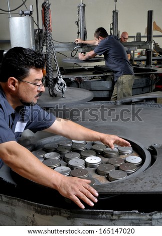 Machine Shop Workers in a precision grinding shop