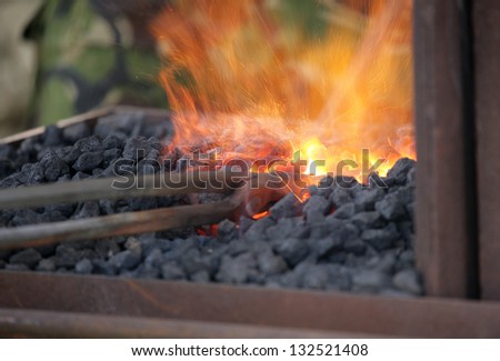 blacksmith at work using traditional methods