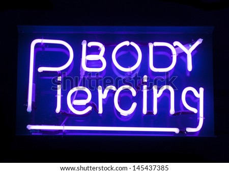 Body piercing neon sign abstract